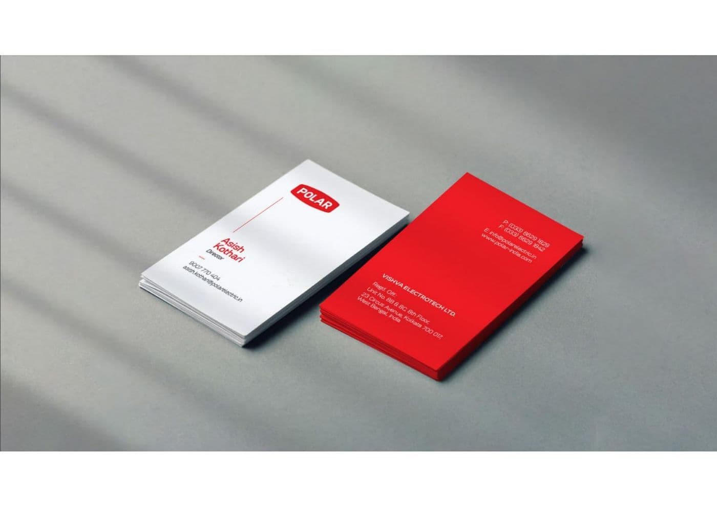 A red and white corporate correspondence suite of cards and letterheads