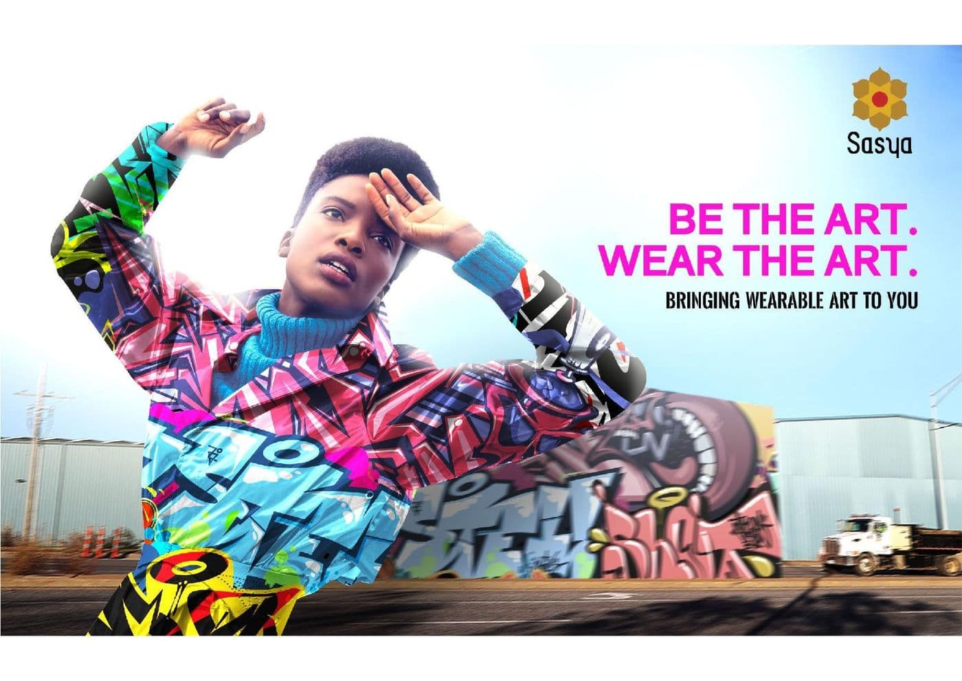 Sasya 'Be The Art, Wear The Art' campaign banner with a model in printed wearable art