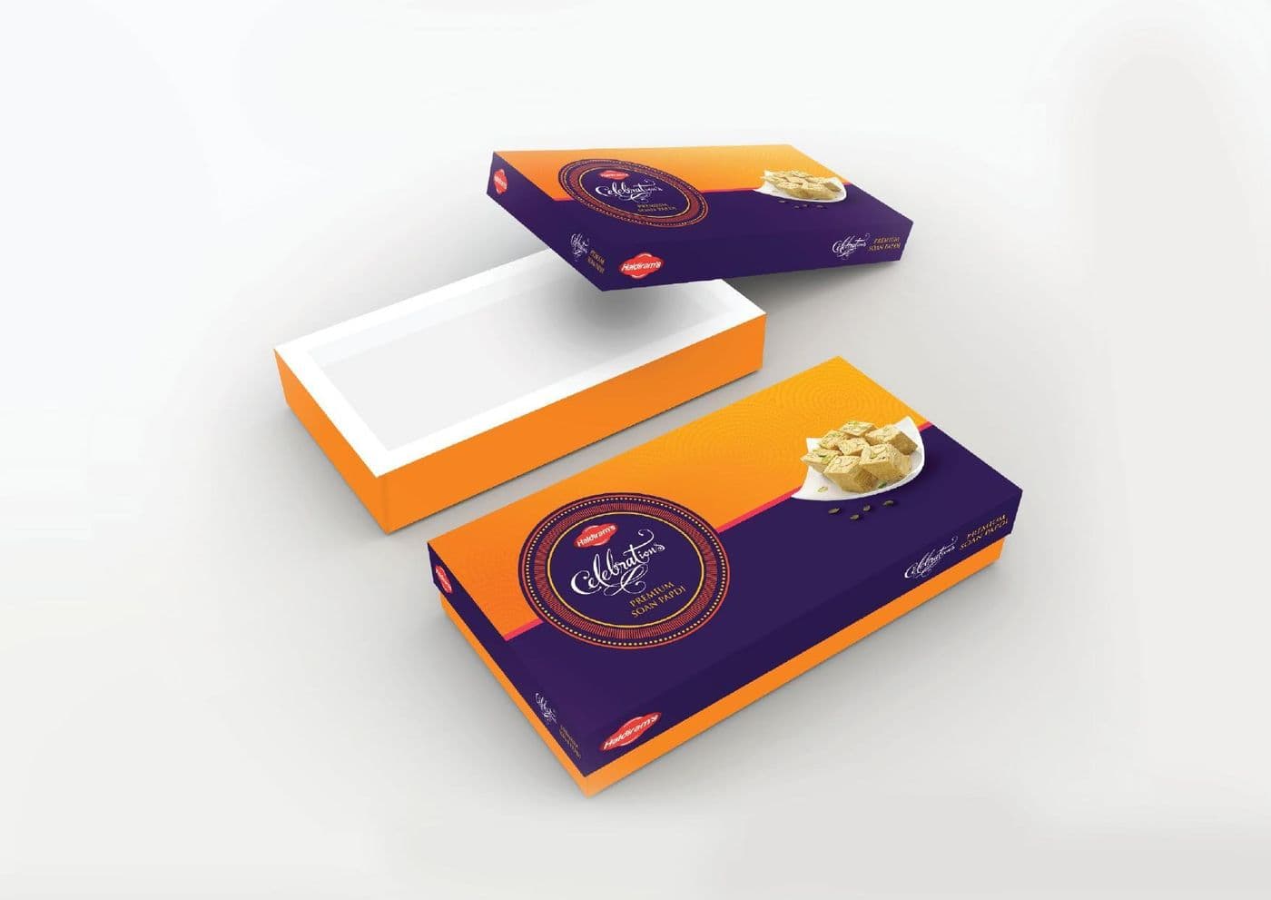 Gifting sweet-box packaging in orange and purple shown as stacked printed structures